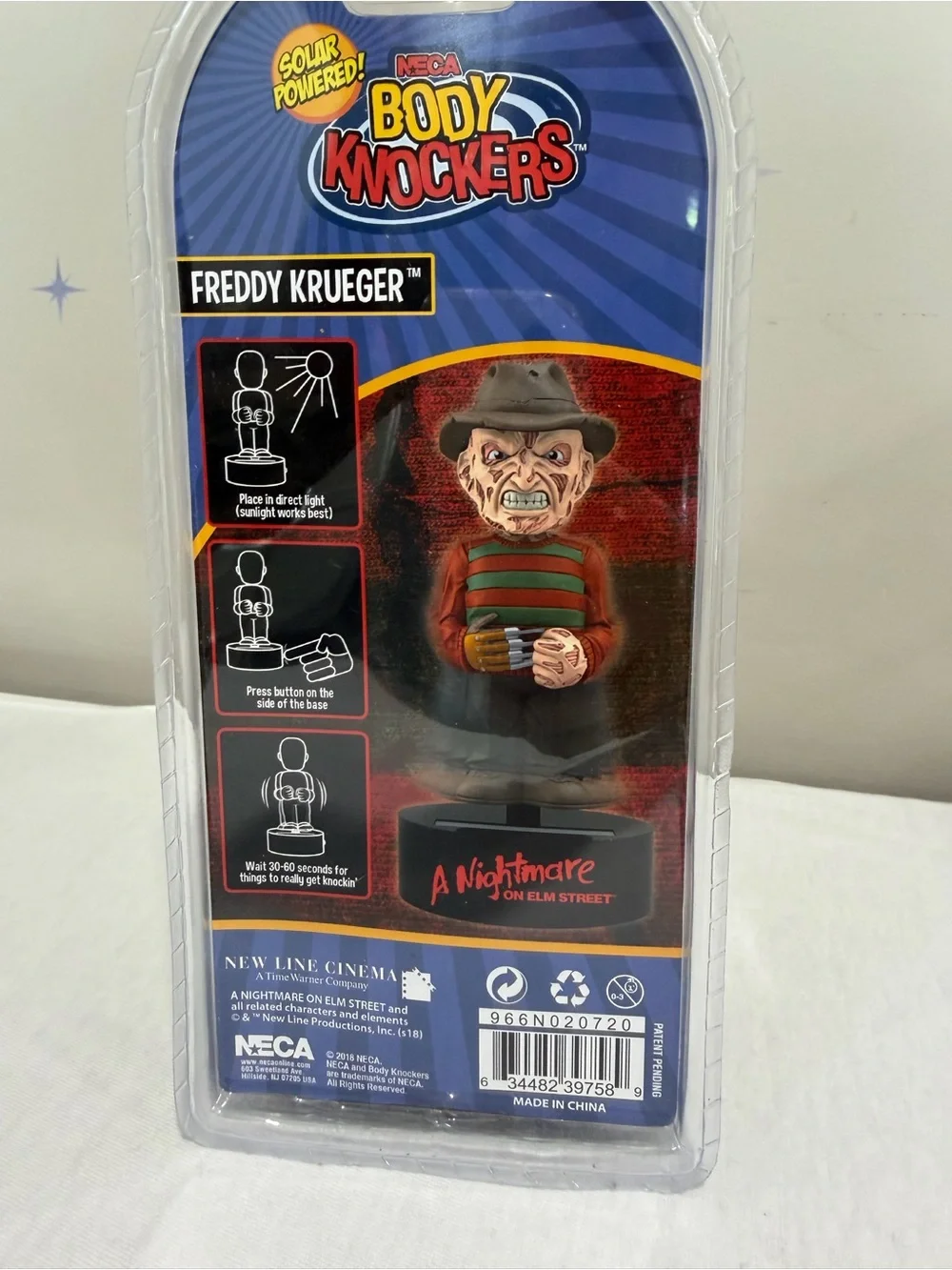 NECA Body Knocker - Freddy-Inspired Horror Figurine in Green & Red
